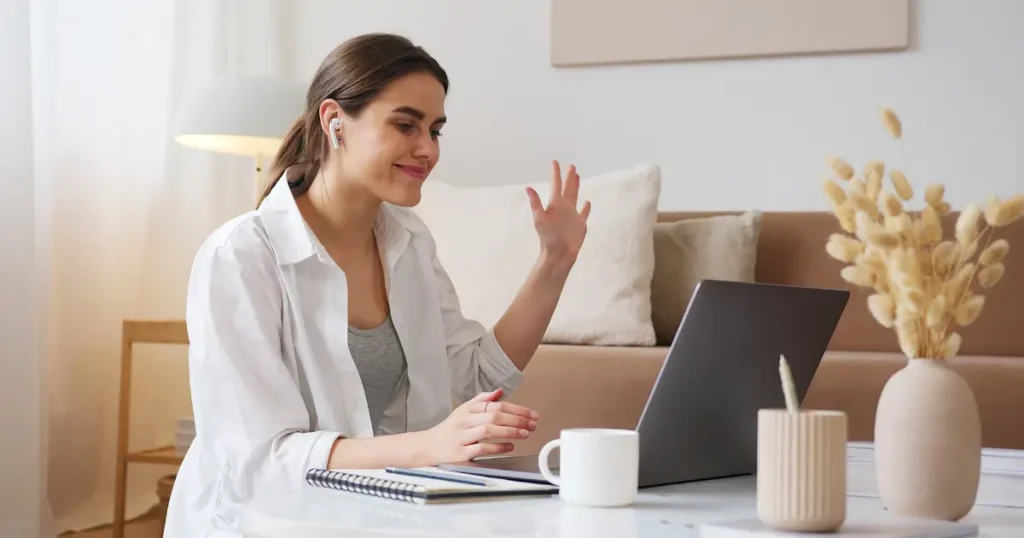 A lady on a video call on her laptop