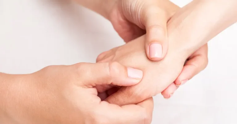 A massage therapist with injured thumbs being supported