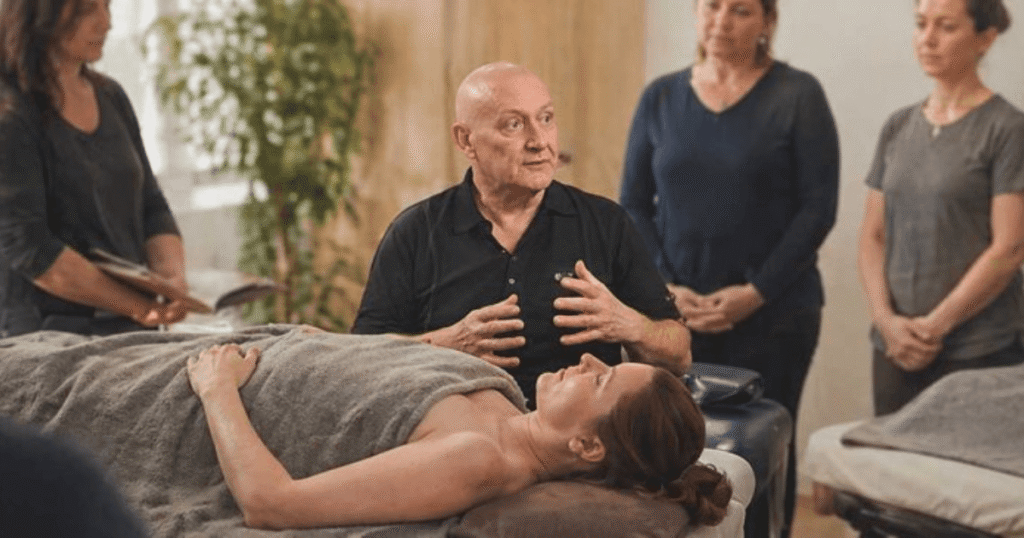 Marc Innes teaching spa students massage
